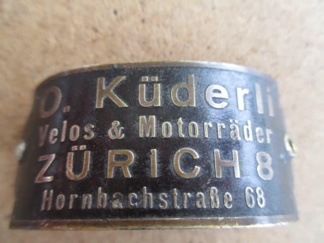 O.Küderli Steuerkopf CH Schild Emblem