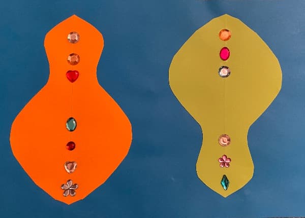 Blauorangegrüner Scherenschnitt