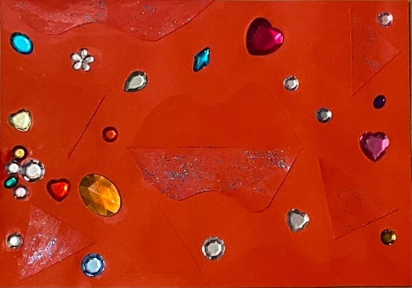 Roter Scherenschnitt mit Farbglitzer