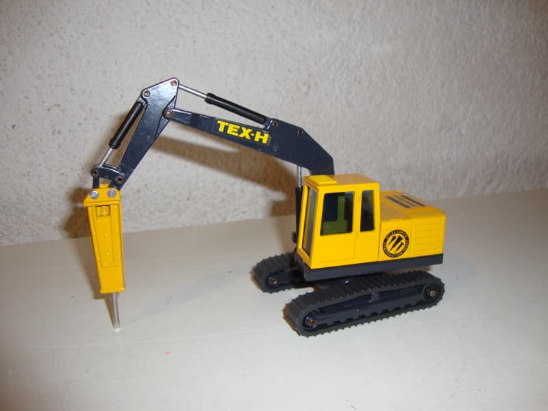Bagger TEX-H Atlas Copco mit Bohrhammer