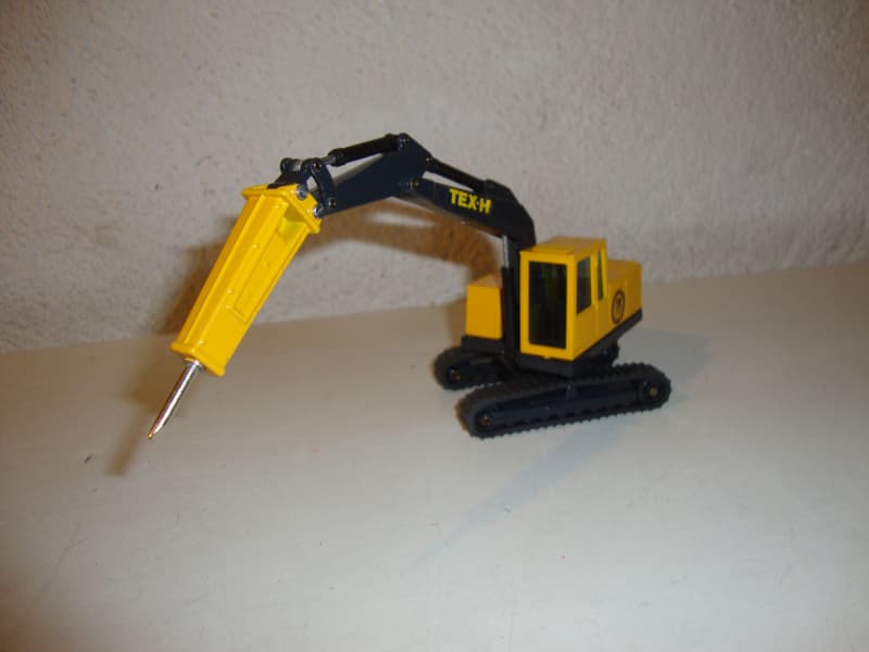 Bagger TEX-H Atlas Copco mit Bohrhammer
