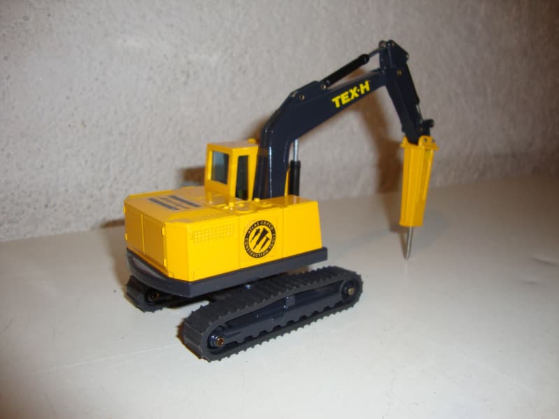 Bagger TEX-H Atlas Copco mit Bohrhammer