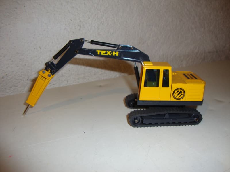 Bagger TEX-H Atlas Copco mit Bohrhammer