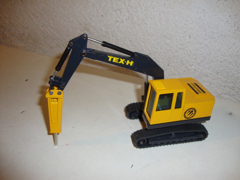 Bagger TEX-H Atlas Copco mit Bohrhammer
